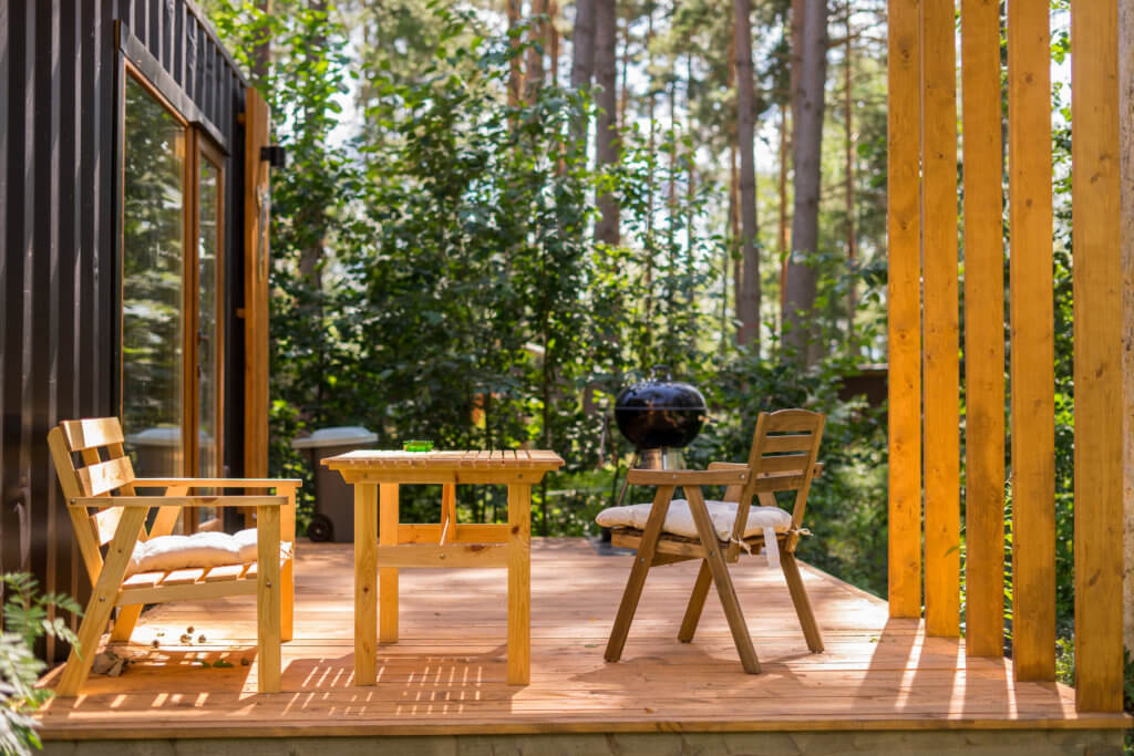 barbecue grill in front of idyllic backyard outdoor party on the holiday camp